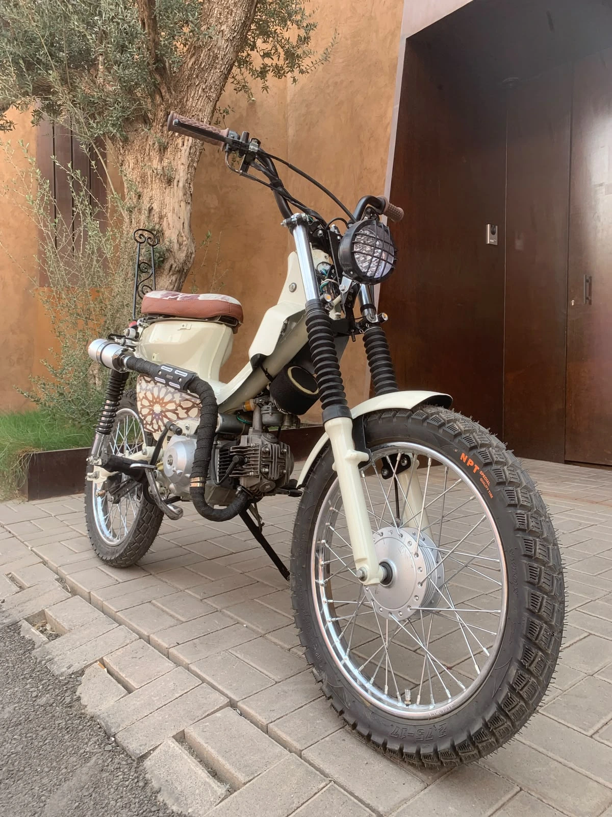 Low-angle front view of the Mouad El Baraka custom motorcycle with Moroccan design details