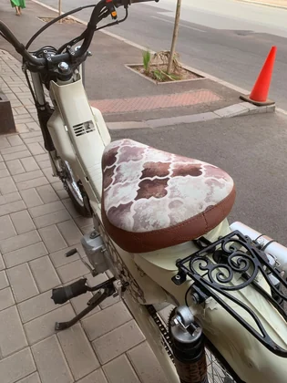 Close-up of the Mouad El Baraka custom motorcycle seat and rear rack details thumbnail