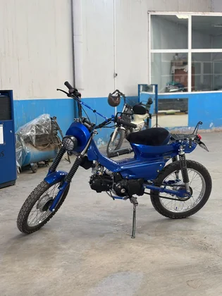 Sidi Bel Abbes custom blue motorcycle three-quarter side view inside the BCE workshop thumbnail