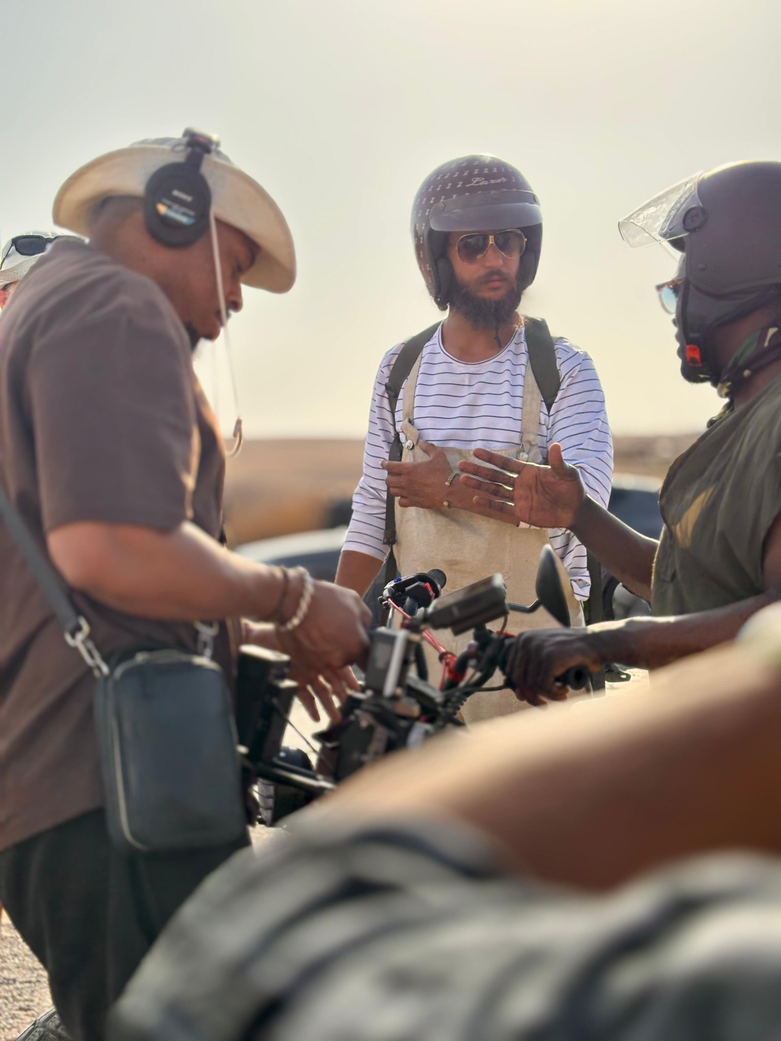 Riders discussing the journey beside the motorcycles