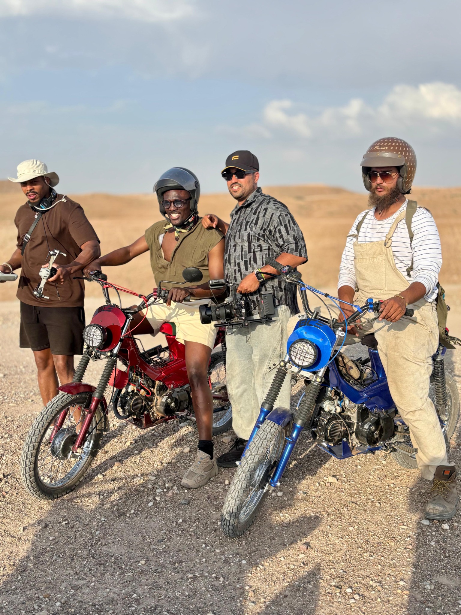 Baraka BCE riders with custom motorcycles in the desert
