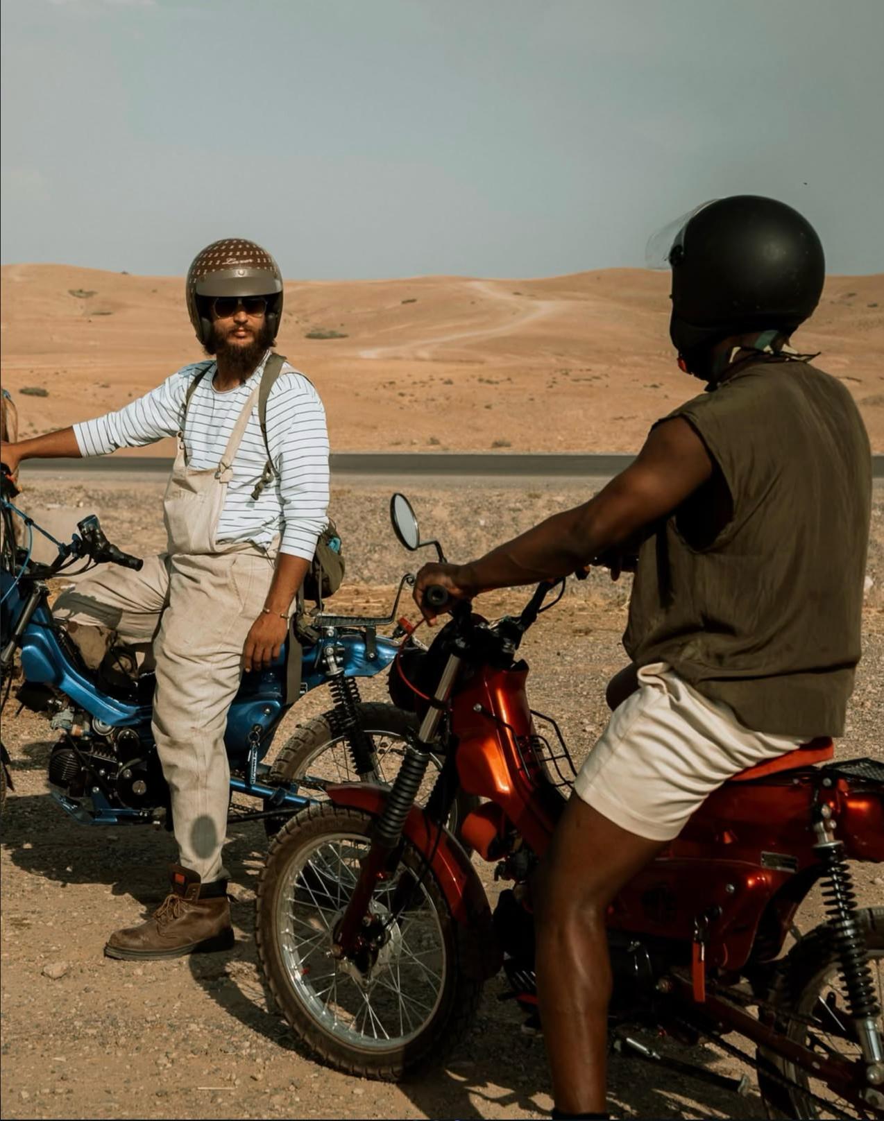 Two riders with custom motorcycles in Agafay