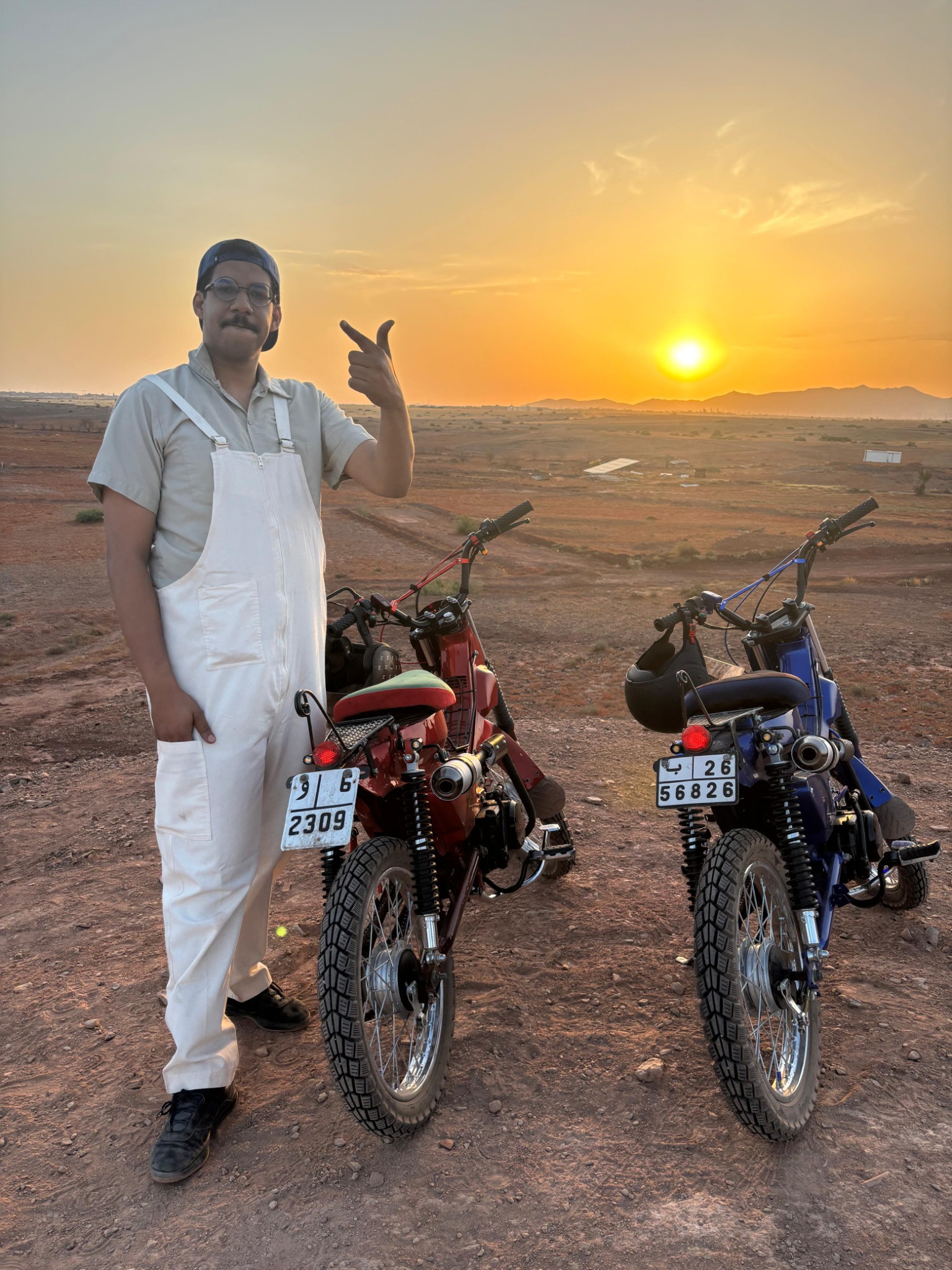 Sunset beside two custom motorcycles